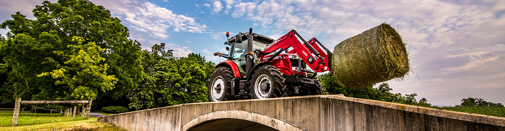 Massey Ferguson Tractor Hauling Hay Bale